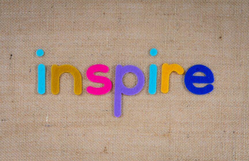 the word inspire on a woven surface